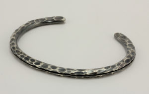 Oxidized sterling silver "joe," bracelet with a highlighted hammered finish.